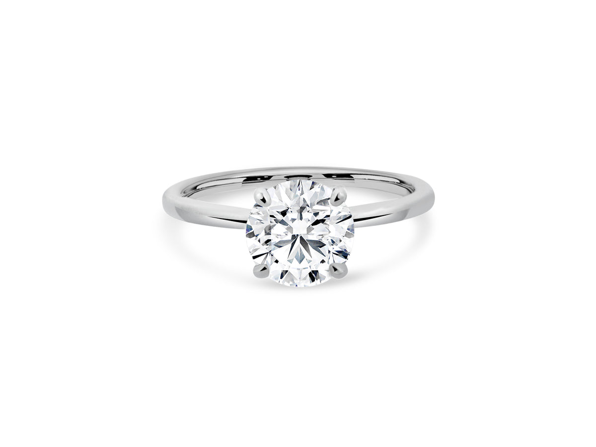 PRIVE'18K WHITE GOLD 1.50CT ROUND SWAROVSKI LAB GROWN DIAMOND WITH .10CT NATURAL VS/G ACCENT DIAMONDS. CERTIFIED