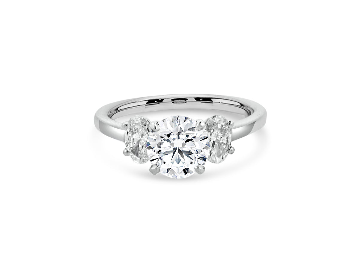 PRIVE'14K WHITE GOLD 1.37CT ROUND SI1 CLARITY AND E COLOR LAB GROWN SWAROVSKI DIAMOND FLANKED WITH .60CT NATURAL OVAL DIAMONDES SI - G/H COLOR.  CERTIFIED. EXCELLENT CUT8