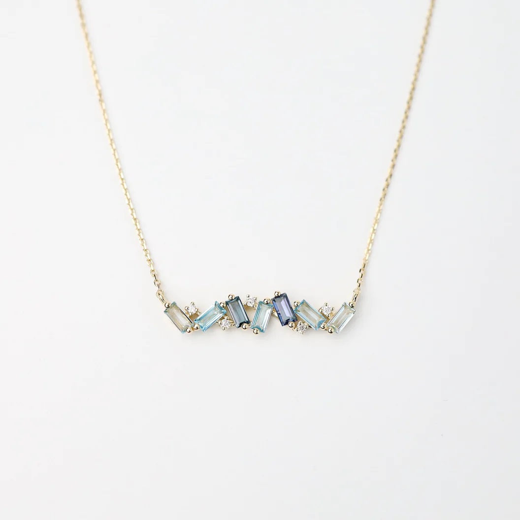 14k Yellow Gold Frenesia Mixed Blue Topaz Bar Necklace4x2mm Baguette-Cut: Swiss Blue Topaz, London Blue Topaz, English Blue Topaz, Blue TopazRound White Diamond, Total Weight 0.05ct.16"/18" Adjustable Chain